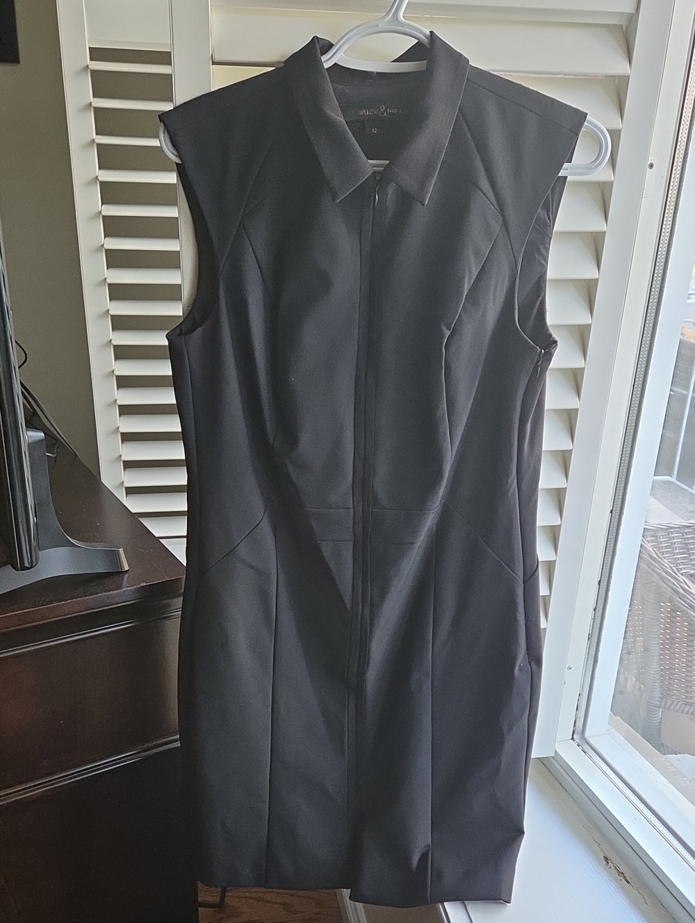 Sleeveless Black Zip-Front Sheath Dress